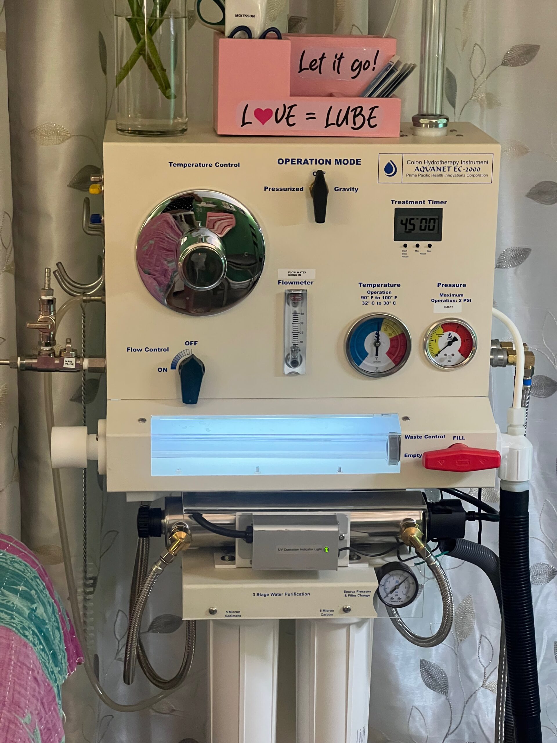 Vintage medical ventilator machine with control knobs and gauges.
